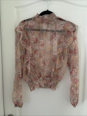 Sheer Pink Floral Ruffle Blouse with Smocked Neck and Hem